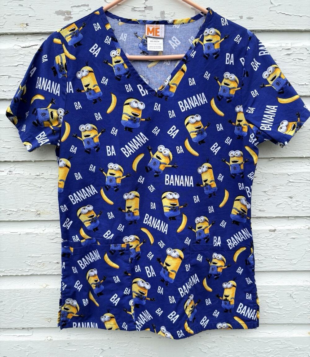 Despicable Me Scrub Top Womens XS Blue Minion Short Sleeved Cotton AOP Medical